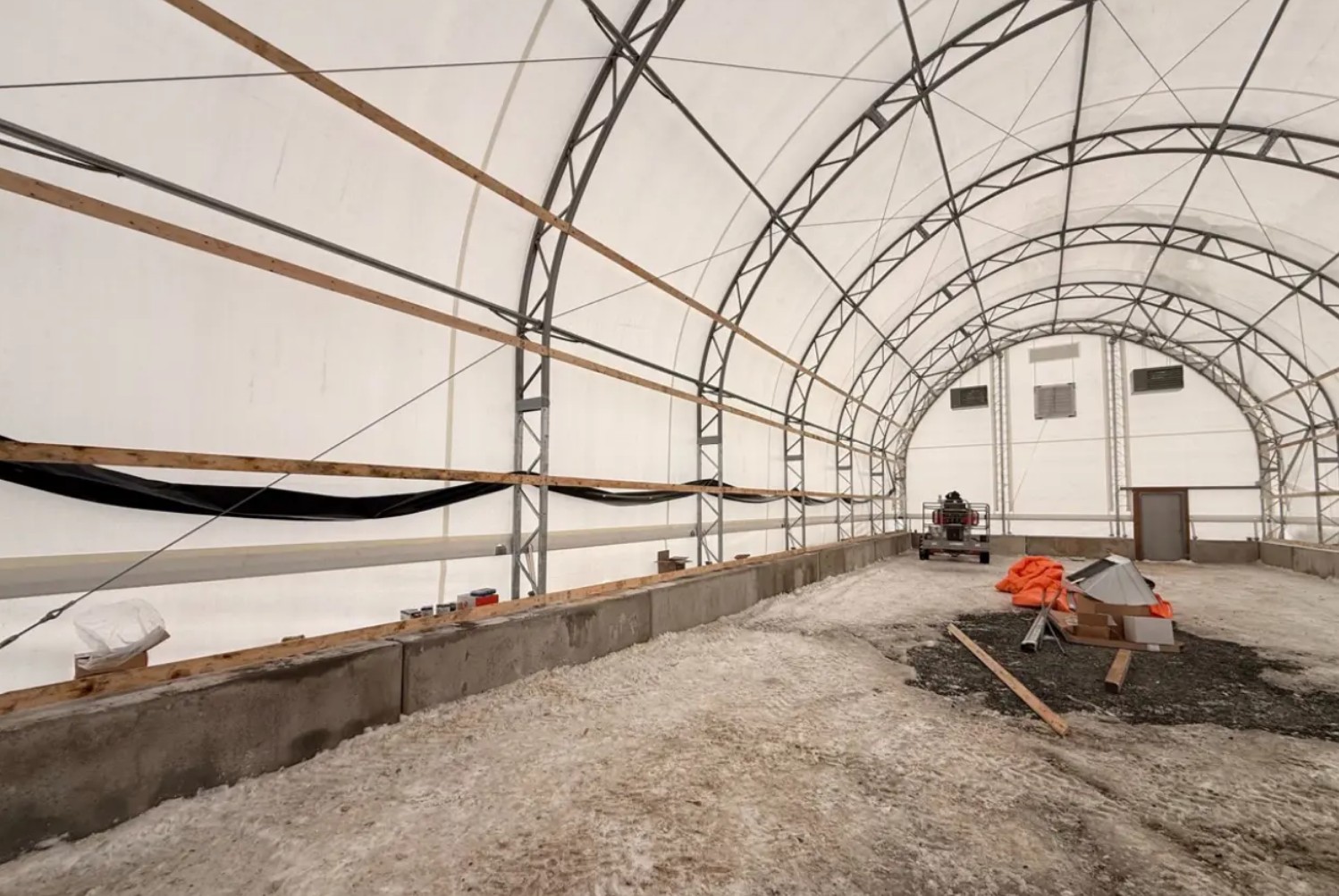 Foil insulation installed inside fabric building